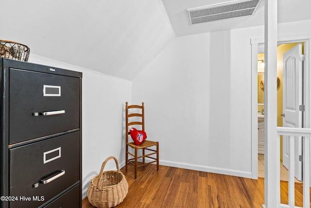 interior space with wood-type flooring and lofted ceiling