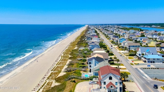 aerial view featuring a view of the beach and a water view