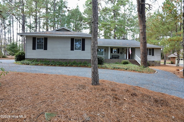 ranch-style house with covered porch