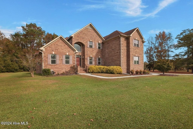 view of property featuring a front yard