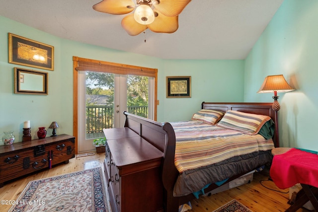 bedroom with access to outside, french doors, vaulted ceiling, light hardwood / wood-style flooring, and ceiling fan