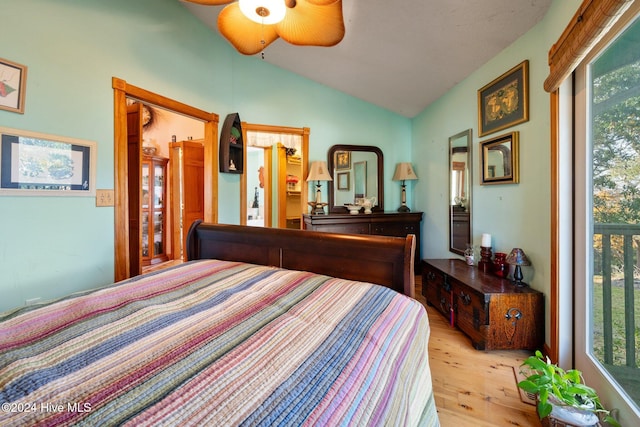 bedroom featuring vaulted ceiling and light hardwood / wood-style flooring