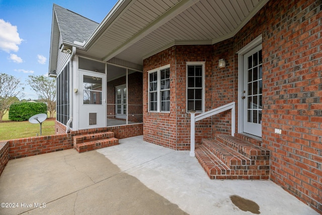 view of patio / terrace with a sunroom