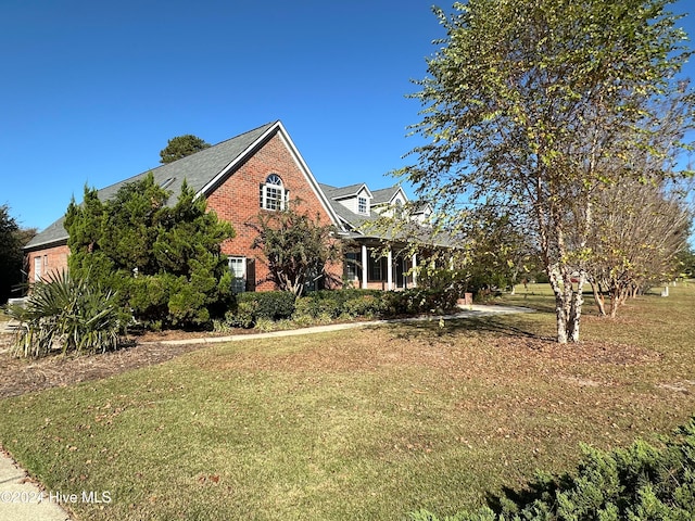 view of property exterior featuring a lawn