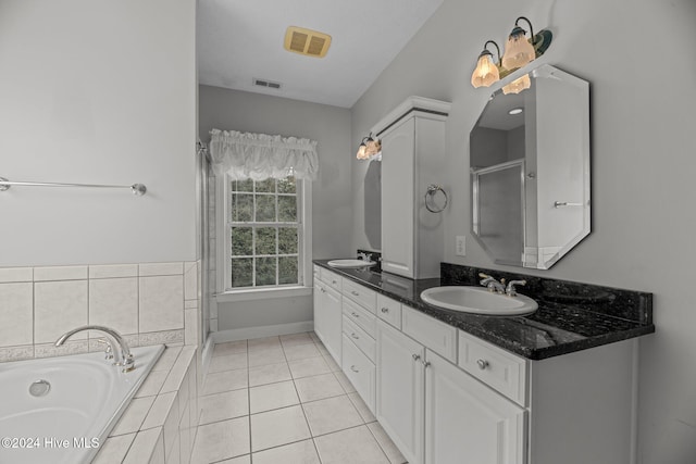 bathroom with vanity, tile patterned floors, and separate shower and tub