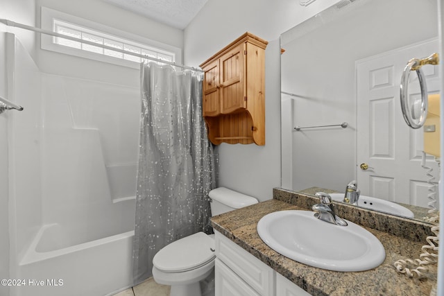 full bathroom with a textured ceiling, vanity, shower / tub combo with curtain, tile patterned flooring, and toilet