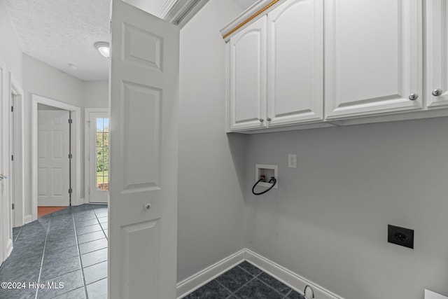 clothes washing area featuring cabinets, washer hookup, hookup for an electric dryer, tile patterned floors, and a textured ceiling