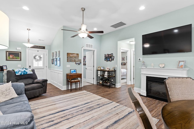 1296 Marsilio Ln SW Unit A, Ocean Isle Beach, NC 28469 - living room featuring wood finished floors, ceiling fan, lofted ceiling, a glass covered fireplace, and recessed lighting