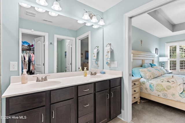 1296 Marsilio Ln SW Unit A, Ocean Isle Beach, NC 28469 - bathroom with ensuite bathroom, double vanity, and a walk in closet