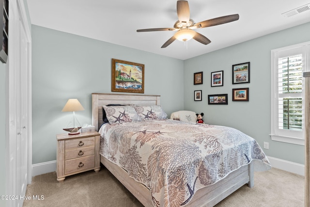 bedroom featuring a closet, carpet, and ceiling fan