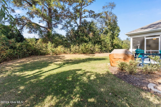 1296 Marsilio Ln SW Unit A, Ocean Isle Beach, NC 28469 - view of green lawn featuring a sunroom