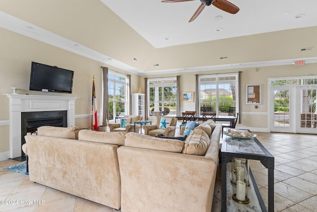 living room featuring crown molding, plenty of natural light, light tile patterned floors, and ceiling fan