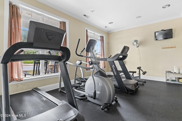 workout area featuring ornamental molding