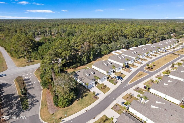 1296 Marsilio Ln SW Unit A, Ocean Isle Beach, NC 28469 - aerial view of property and surrounding area with a heavily wooded area and nearby suburban area