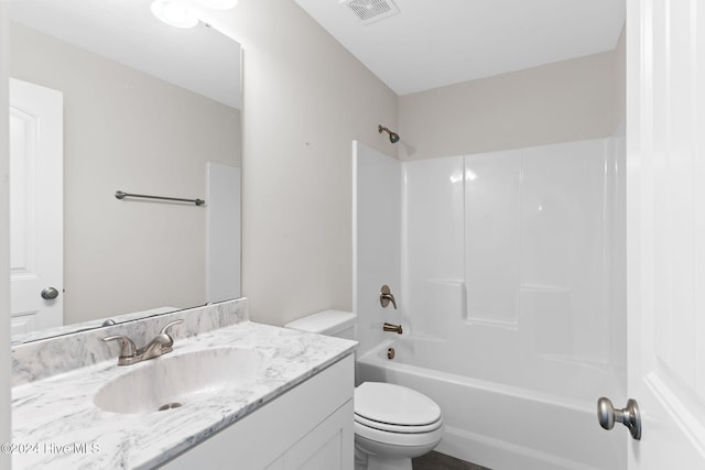 full bathroom with toilet, vanity, and shower / bath combination