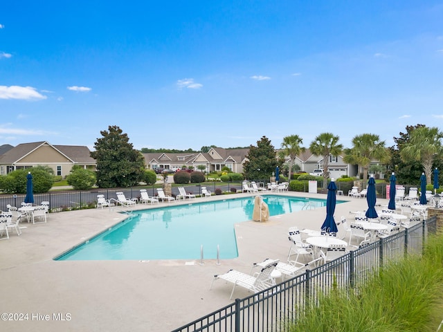 view of swimming pool with a patio area