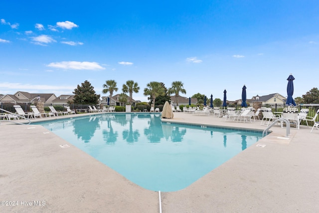 view of swimming pool featuring a patio