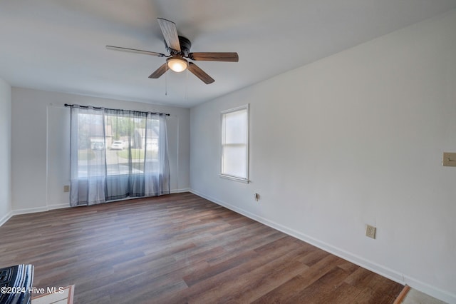 spare room featuring hardwood / wood-style flooring and ceiling fan