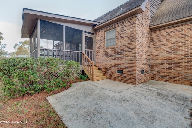 doorway to property featuring a patio