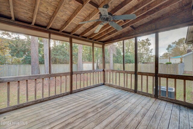 unfurnished sunroom with ceiling fan and lofted ceiling