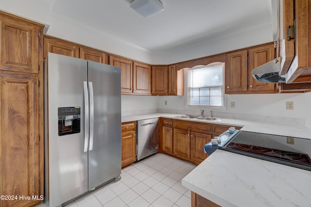 kitchen featuring sink, light tile patterned floors, crown molding, and stainless steel appliances