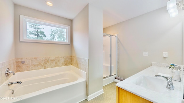 bathroom featuring tile patterned floors, vanity, and independent shower and bath