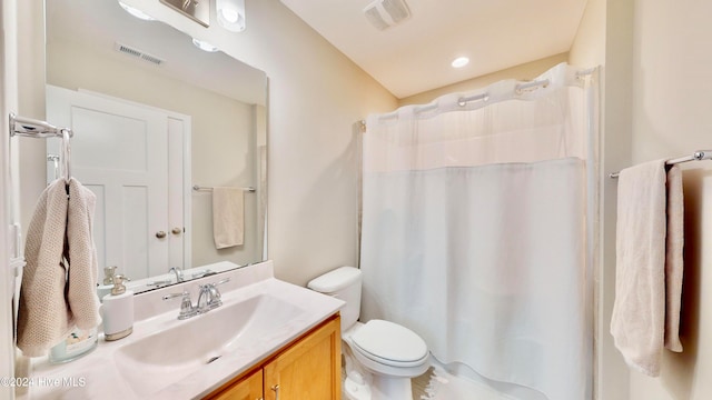 bathroom with a shower with curtain, vanity, and toilet