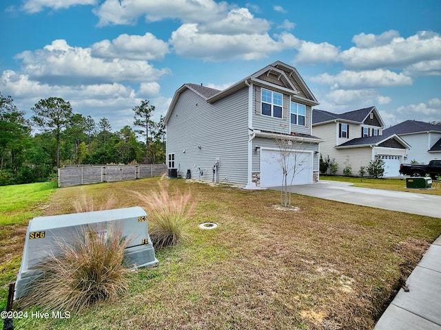 view of home's exterior with a yard and a garage