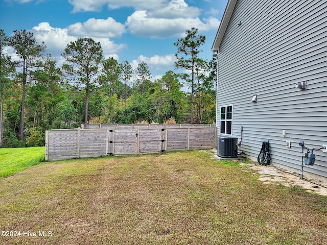 view of yard with central AC unit