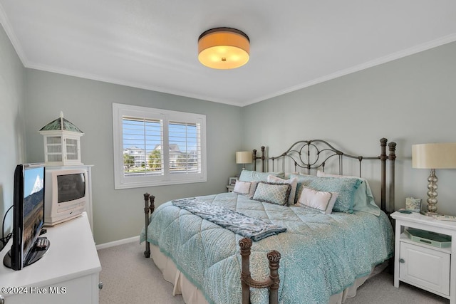 carpeted bedroom with crown molding