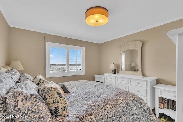 bedroom featuring crown molding