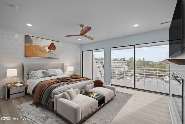 bedroom featuring ceiling fan, access to outside, recessed lighting, and light wood-style floors