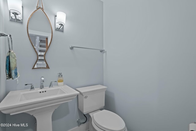 bathroom featuring sink and toilet