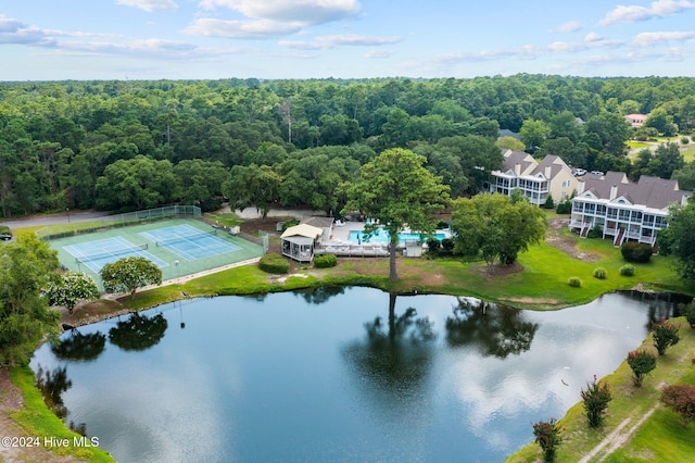 bird's eye view with a water view and a view of trees