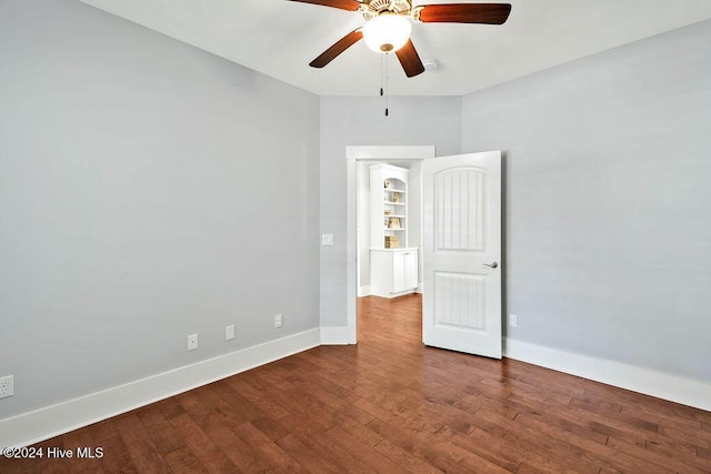 spare room featuring ceiling fan and hardwood / wood-style flooring