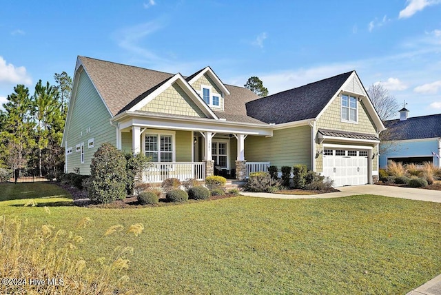 craftsman house with a garage, covered porch, and a front yard