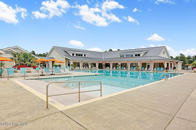 view of swimming pool featuring a patio