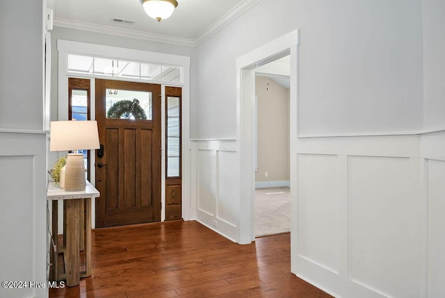 foyer featuring dark hardwood / wood-style flooring and ornamental molding