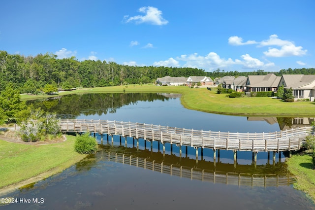 surrounding community featuring a water view