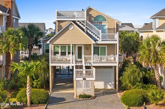 coastal inspired home with a garage