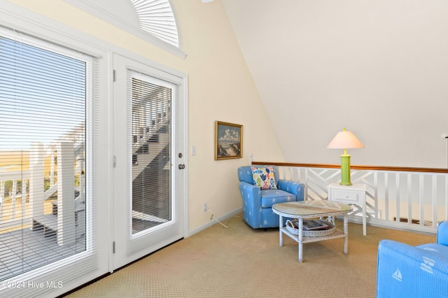 living room featuring ceiling fan, high vaulted ceiling, and carpet