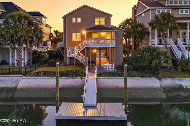 view of back house at dusk