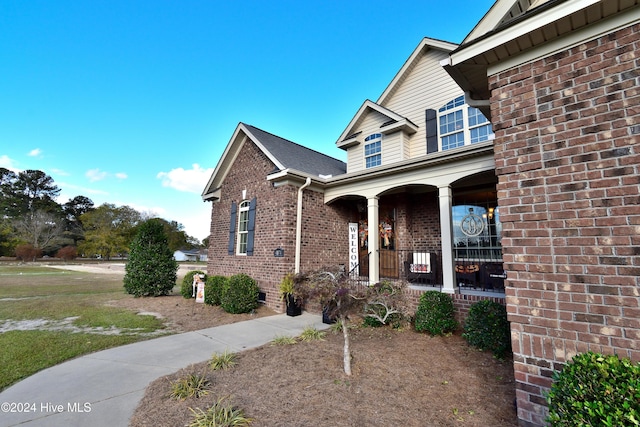 view of front of property featuring covered porch