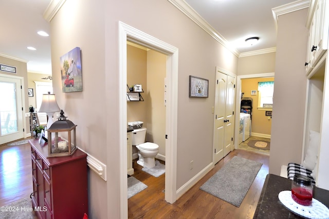 hall with dark hardwood / wood-style flooring and crown molding