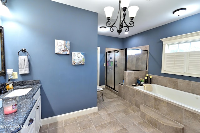 bathroom with tile patterned floors, vanity, independent shower and bath, and a notable chandelier