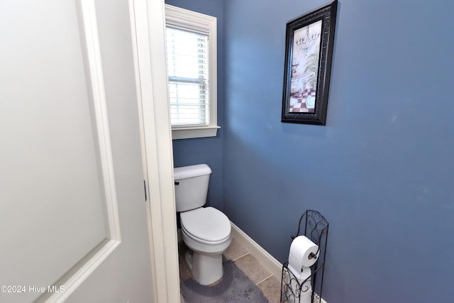 bathroom featuring tile patterned flooring and toilet