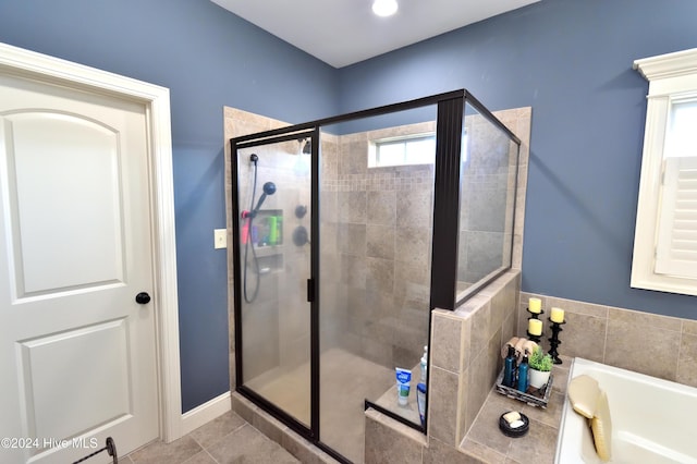 bathroom featuring tile patterned floors and plus walk in shower