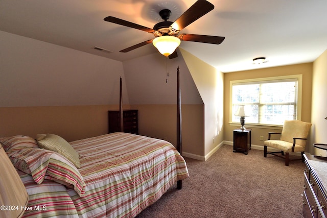 bedroom with vaulted ceiling, carpet floors, and ceiling fan