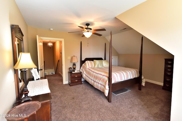 bedroom with ceiling fan, lofted ceiling, and dark carpet