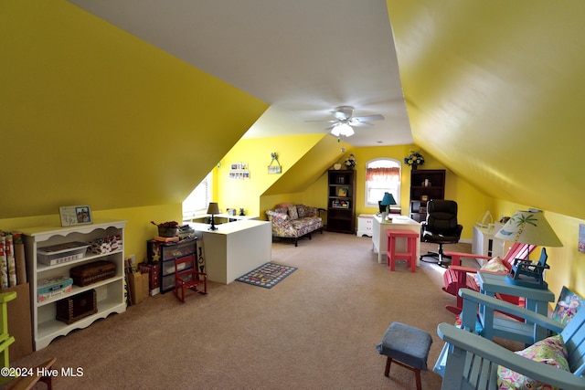 bedroom featuring lofted ceiling and carpet